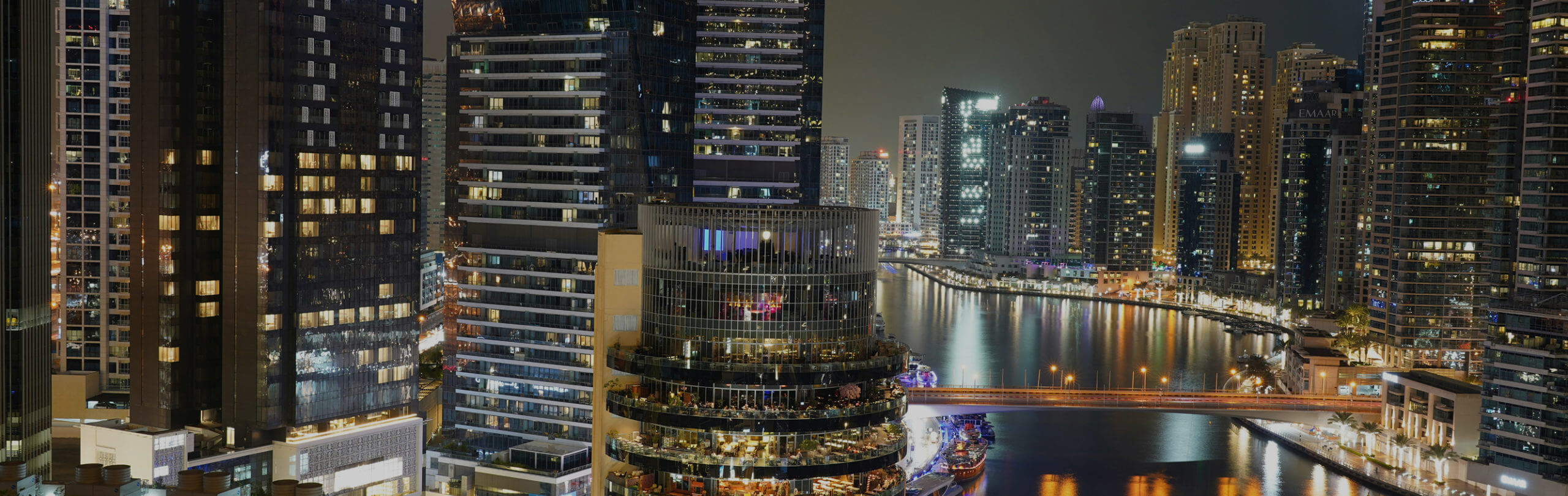 Sports car parked in front of Dubai landmark