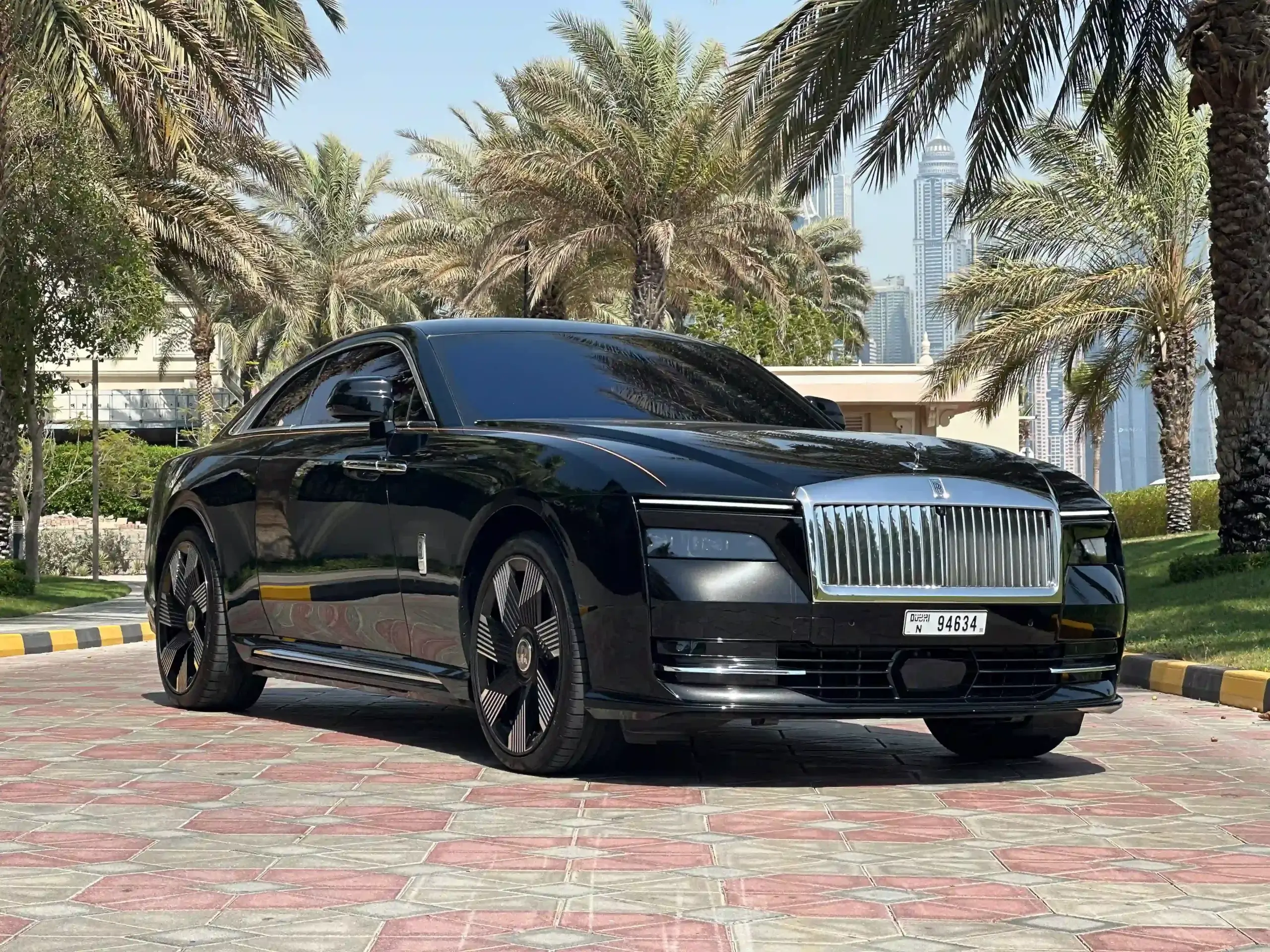 Rolls-Royce Spectre front view highlighting its iconic grille and Spirit of Ecstasy